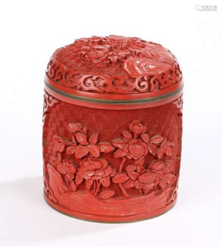 Cinnabar pot and cover, with a carved lid above the circular body with conforming decoration