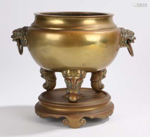 Chinese brass censer, Qing Dynasty, the circular body with lion mask handles above beast capped