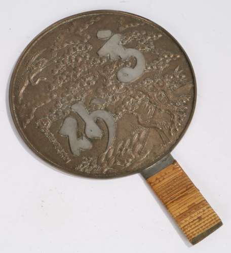 Japanese Edo period bronze hand held mirror, with storks around a blooming tree and Japanese text,