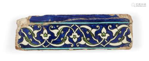A Damascus border tile, late Mamluk, 16th century, of rectangular form, the cobalt ground