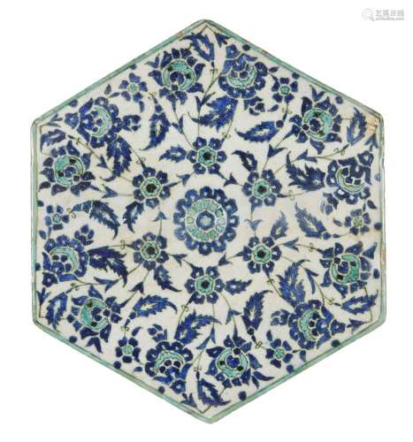 An Iznik style tile, Turkey, early 20th century, of hexagonal form, underglaze painted in