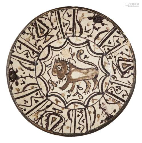 A large underglaze painted pottery bowl with lion, possibly Spain or North Africa, 19th century,