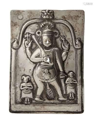 A silver repousse plaque of Shiva, South India, 19th century, of rectangular form, Shiva depicted in
