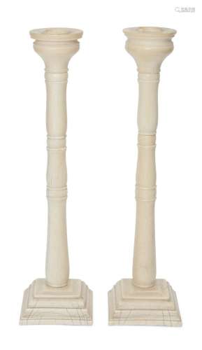 A pair of Anglo-Indian ivory candlesticks, Murshidabad, India, circa 1820, of tapered form, on