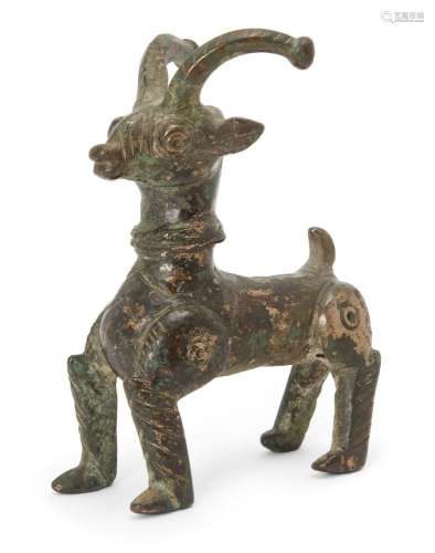 A Ghaznavid figure of a horned animal, Iran, 14th century, depicted standing with forelegs bent,
