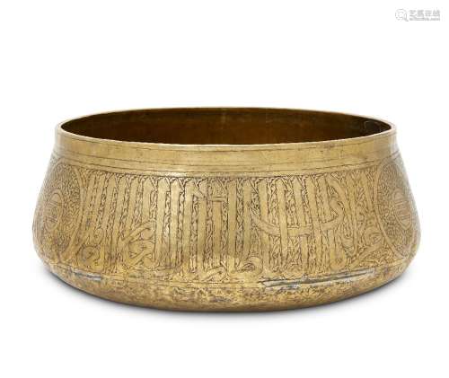 A large late Mamluk brass bowl, Syria or Egypt, late14th-early 15th century, hammered and engraved