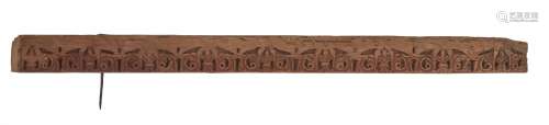 A work carved wood beam with vegetal design an traces of red paint, North Africa or Spain, 12th-15th