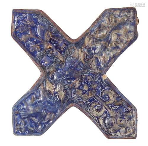 Two Ilkhanid Lajvardina cruciform moulded tiles, Iran, late 13th century, the first moulded under
