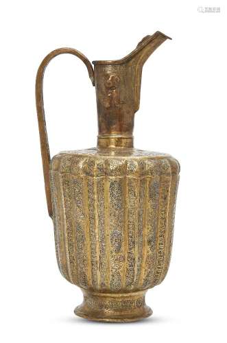 A silver and copper-inlaid brass high-spouted ewer, Khorassan, late 12th century, constructed out of