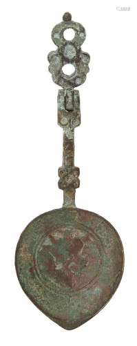 A small engraved bronze spoon, Iran, 12th-13th century, the spoon of shallow form with pointed