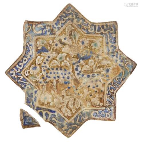 A Kashan star-shaped moulded pottery tile with animals and inscription, Iran, 12th century, the