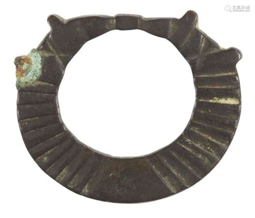 An iron Terret (reign ring), possibly Iron Age, and a small perforated vessel, ring 5.1cm. diam. (2)