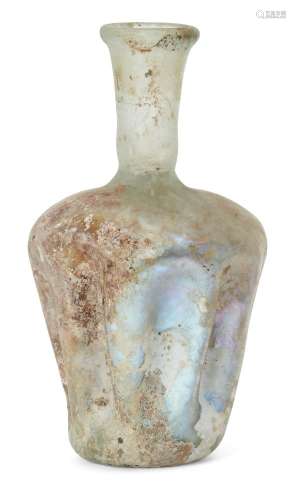 A Roman glass vessel, Rhineland, circa 3rd-4th century AD., with rounded shoulders and tapering