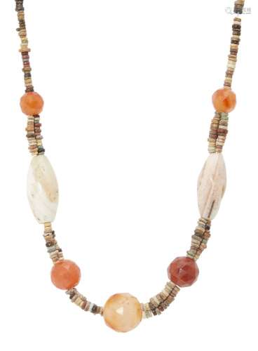 An ancient chalcedony, faience disc bead necklace, 48cm. long Provenance: Private collection,
