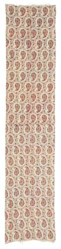 A long Jamawar wool panel, England, 19th century, the cream field woven with rows of repeating red