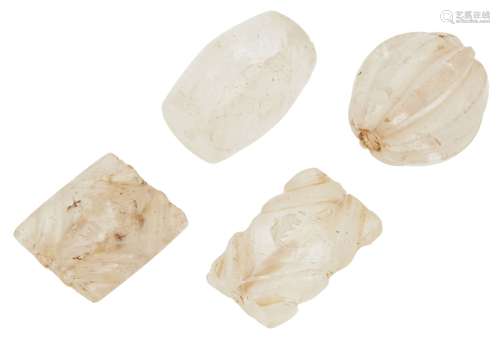 Four carved rock crystal beads, India or Iran, 17th century and earlier, one of round lobed form,