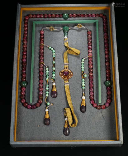 A TOURMALINE CARVED NECKLACE