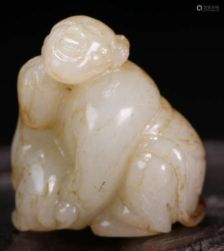 A HETIAN JADE CARVED CHILD SHAPE PENDANT