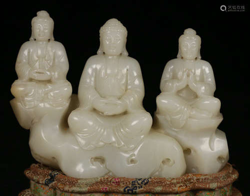 A HETIAN JADE CARVED BUDDHA STATUE