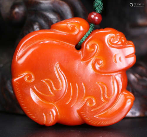 A YELLOW JADE CARVED TIGER SHAPE PENDANT