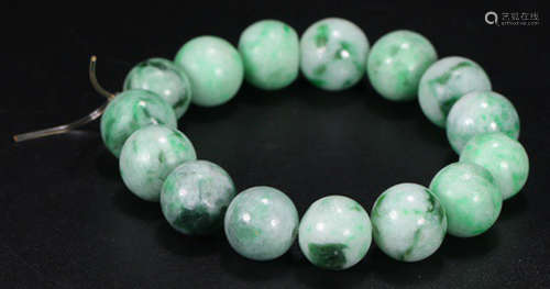 A JADEITE CARVED BRACELET