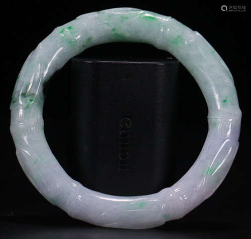 A JADEITE CARVED BANGLE