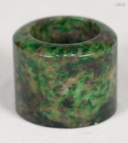 A JADEITE CARVED RING