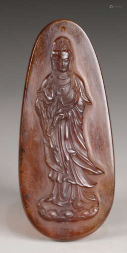 AN OLD AMBER TABLET CARVED WITH GUANYIN BUDDHA