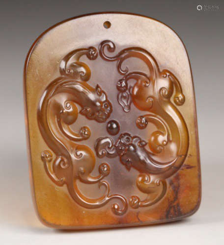 AN OLD AMBER TABLET CARVED WITH DRAGON