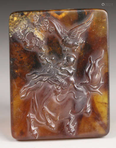 AN OLD AMBER TABLET CARVED WITH HORSE