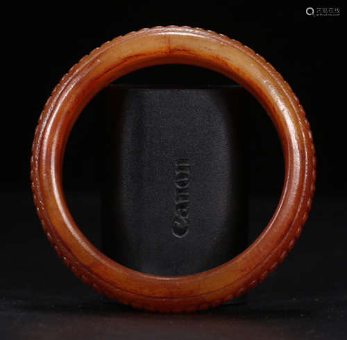 AN ANTIQUE JADE BANGLE CARVED WITH BEAST PATTERN
