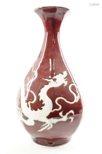 A RED UNDERGLAZED DRAGON VASE