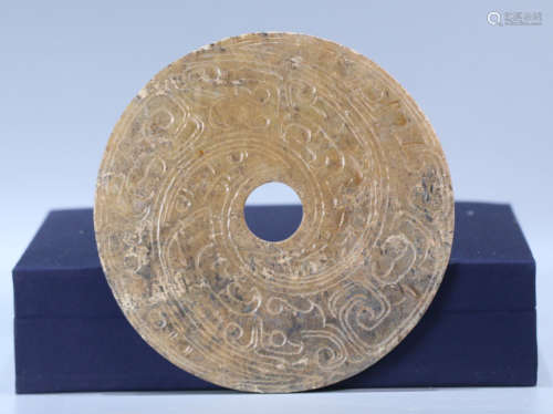 AN ANTIQUE JADE BI CARVED WITH BEAST PATTERN