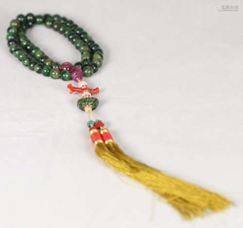 AN OLD JADEITE STRING BRACELET WITH 56 BEADS