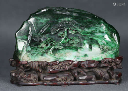 A JADEITE PENDANT CARVED WITH STORY PATTERN