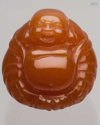 A SOAPSTONE CARVED MAITREYA BUDDHA