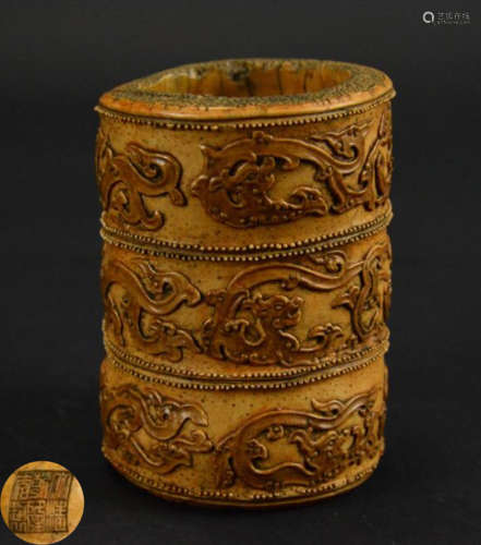 A BAMBOO BRUSH POY CARVED WITH DRAGON PATTERN