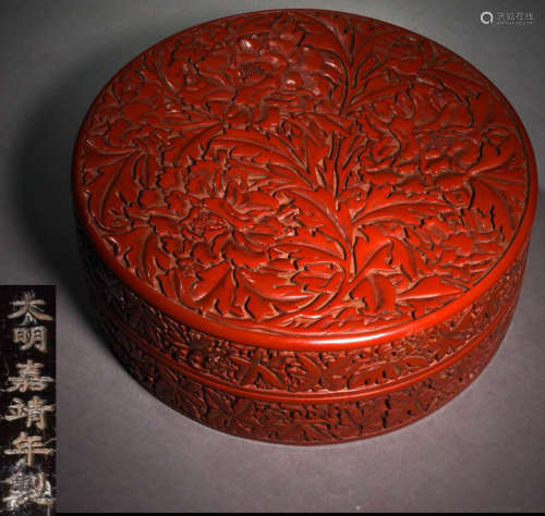A RED LACQUER BOX CARVED WITH AUSPICIOUS PATTERN