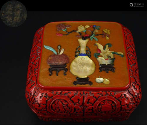 A RED LACQUER BOX EMBEDDED WITH GEM