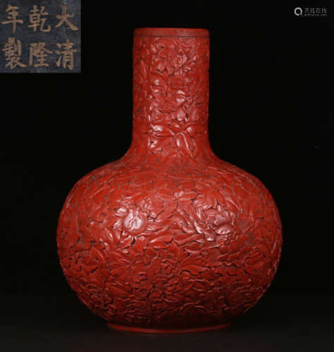 A RED LACQUER VASE CARVED WITH FLOWER PATTERN