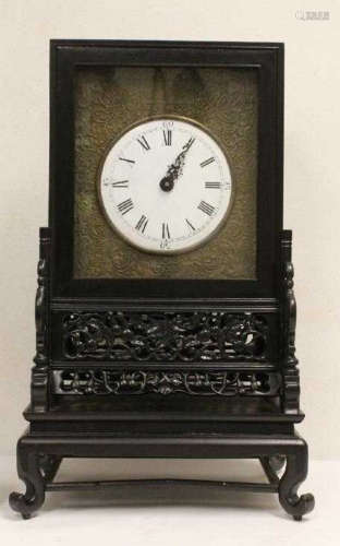 A CHENXIANG WOOD CARVED CLOCK WITH BASE