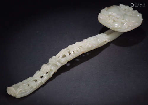AN OLD HETIAN JADE RUYI CARVED WITH PEACH