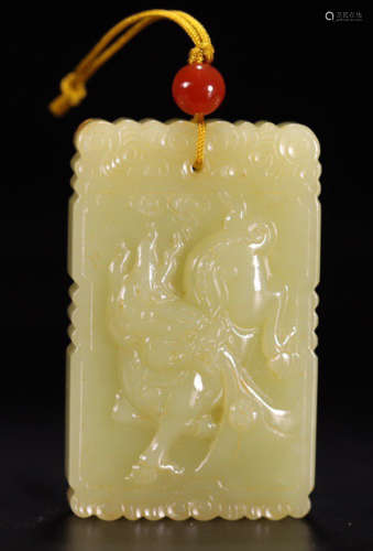 AN OLD HETIAN YELLOW JADE TABLET CARVED WITH QILIN