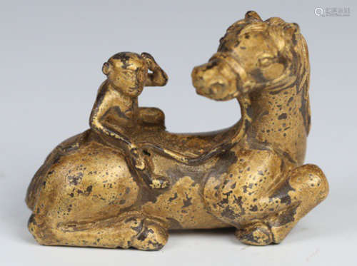 A GILT BRONZE PAPERWEIGHT SHAPED WITH HORSE