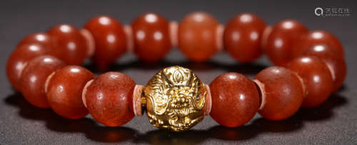 A MYANMAR AMBER BRACELET WITH GOLD