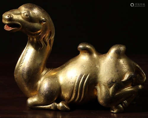 A GILT BRONZE CASTED CAMEL SHAPED PENDANT