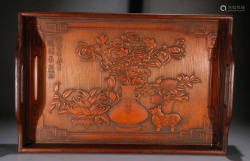 A RED WOOD CARVED TRAY