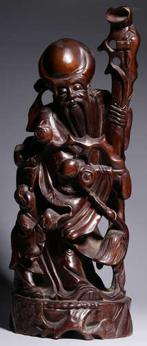 A LONGYAN WOOD CARVED ELDER SHAPE ORNAMENT