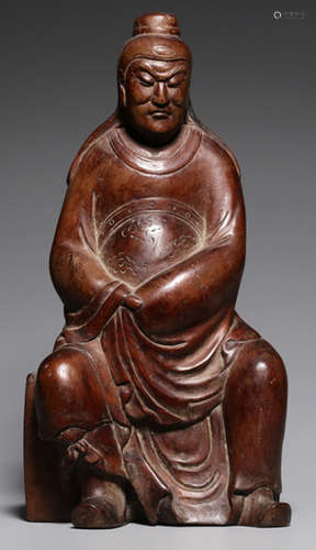 A HUANGYANG WOOD GUANGONG SHAPE STATUE