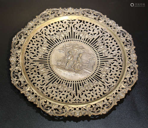 A SILVER CASTED PLATE